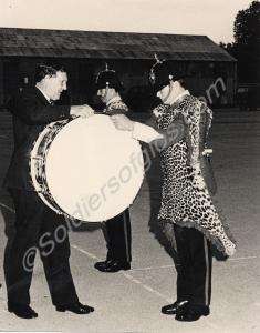 The M.G.R.A. presenting an inscribed drum to the G