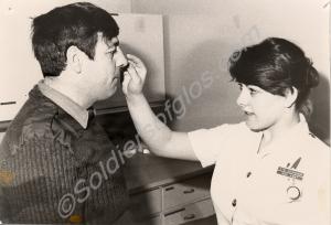 Private Grant receiving First Aid from Private O'C