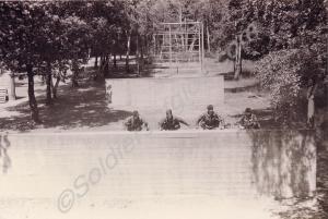Soldiers tackling an assault course. 1st Battalion