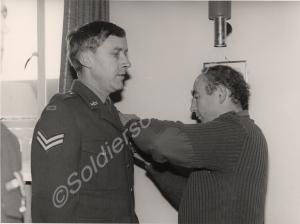 Corporal Spearey receiving medal from 'G.O.C.'. 1s