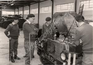 Inspecting a Land Rover engine in the workshop. Re