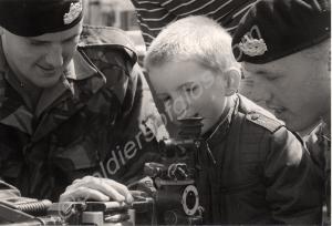 Young boy inspecting a G.P.M.G.  Gloucestershire R