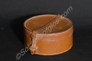 Round leather collar box with strap.