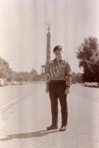 Soldier standing in front of the Victory Column. T