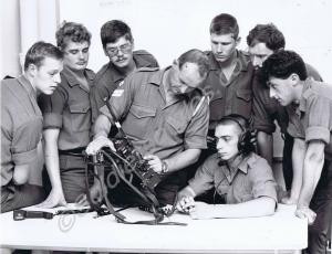 Corporal Baker explaining radio set. Gloucestershi