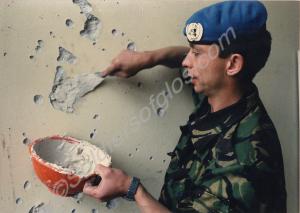 Lance Corporal Wood filling in bullet and shrapnel