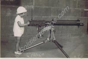 Small child with Vickers machine gun. Hugh Michael