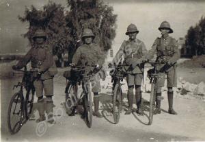 Four sergeants with bicycles. 1st Battalion, The G