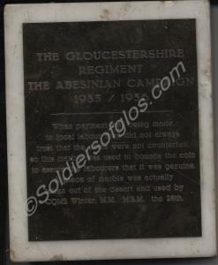 Piece of marble, 12.5cm x 16cm. With brass plate w