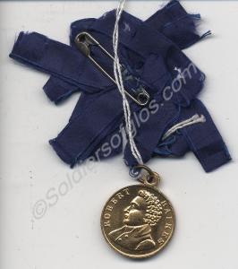 Gold-coloured medallion with blue ribbon. Struck t