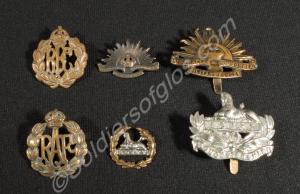 Six cap badges; two of the Gloucestershire Regimen