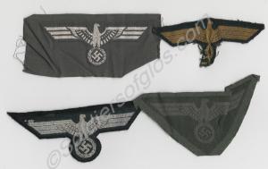 Items of German Wehrmacht uniform insignia. Four c
