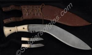 Ivory handled kukri with two small kukris in leath