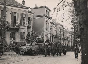 German prisoners marching past a Churchill AVRE. A