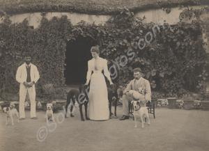 Lady and two gentlemen with dogs (terriers and sa