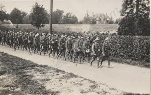 Column of soldiers marching down a lane.  Gloucest