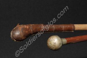 Two swagger sticks, one with silver ball top beari
