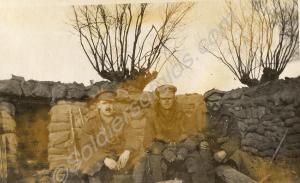 Three soldiers sat by dug-out. 1st Battalion, The