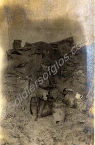 Brewing tea by a trench. 1st Battalion, The Glouce
