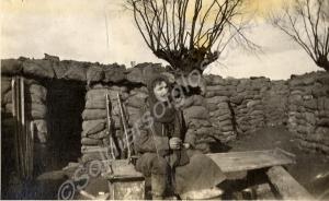 Captain Roger Douglas Scott sitting in front of du