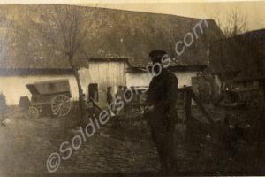 Lieutenant L.C. Brown standing in farmyard.  1st B