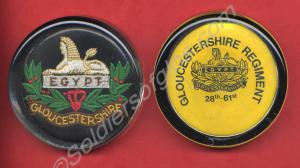 Two Gloucestershire Regiment paper weights. c. 199