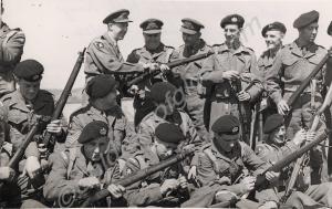 Cleaning weapons on the rifle range.  5th (Territo