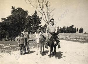 Regimental Sergeant-Major Smyth on donkey.  1st Ba