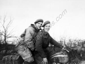 Despatch rider on motor bike with passenger. 56238