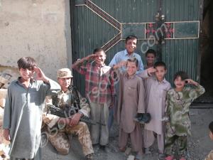 Corporal Mann with local children. Operation Herri