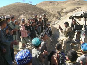 Private Gaunavu entertains some locals. Operation