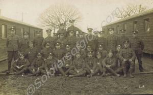 Platoon outside huts. 1/6th Battalion, The Glouces