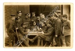 Group of soldiers playing cards. Features 220494 L