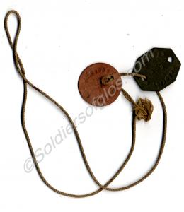2 dog tags on string. Belonged to 6205073 Private
