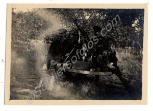 Features World War I soldiers in an orchard to the