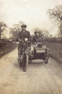 Henry Buckle and his wife with motorcycle and side