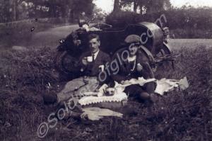 Henry Buckle and his wife with motorcycle and side