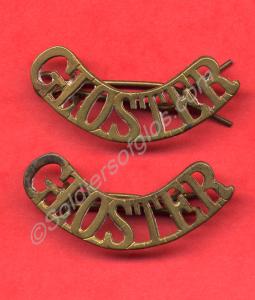 Two brass shoulder titles. William Reginald Franci