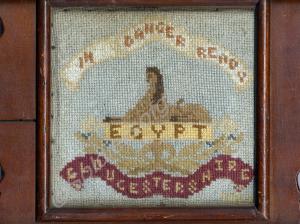 Framed needlework sampler depicting Gloucestershir