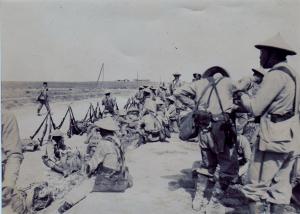 French Indo-Chinese colonial troops waiting by roa
