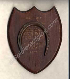 Wooden plaque with horseshoe made from Boer shell
