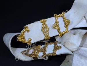 Pair of white colours belts, dated 1999.