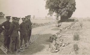 Rifle practice in a trench. Postcard sent to his m