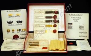 Box with various  sealed patterns of badges and bu