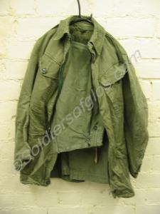 Green combat jacket and trousers.