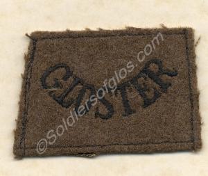 Black on khaki serge shoulder title. Gloucestershi