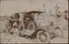 Car driving along a dirt road.  India c. 1918.