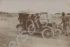 Car driving along a dirt road.  India c. 1918.