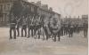 Troops marching in full dress during a royal visit