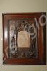 In Memoriam panel enclosed in carved wood. Awarded